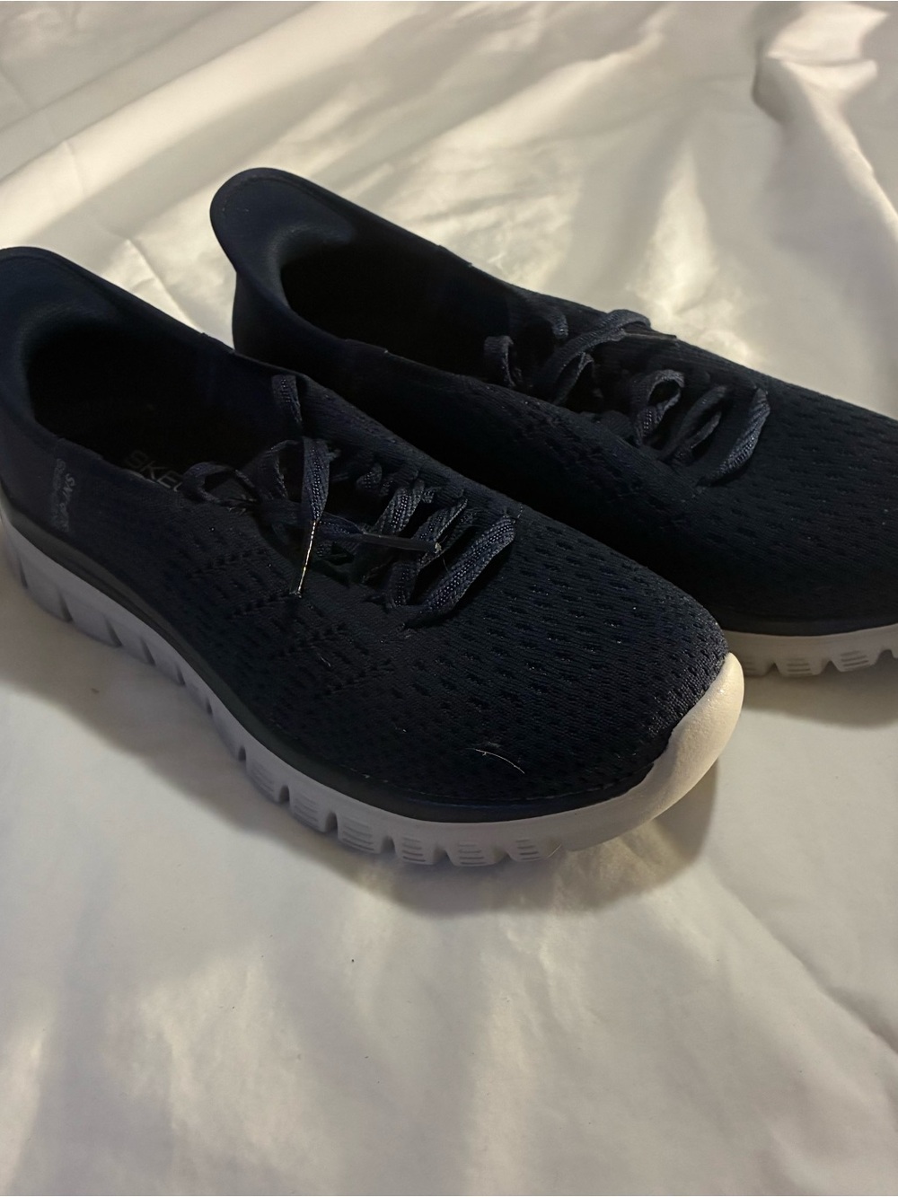 Skechers navy slip-on casual sneaker with white sole